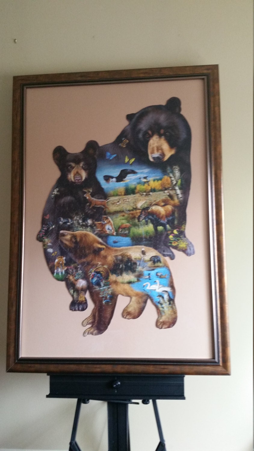 Professionally Framed 1000pc completed Sunsout Bear Family Adventure shaped puzzle wall art. Eco Friendly item with gloss finish.