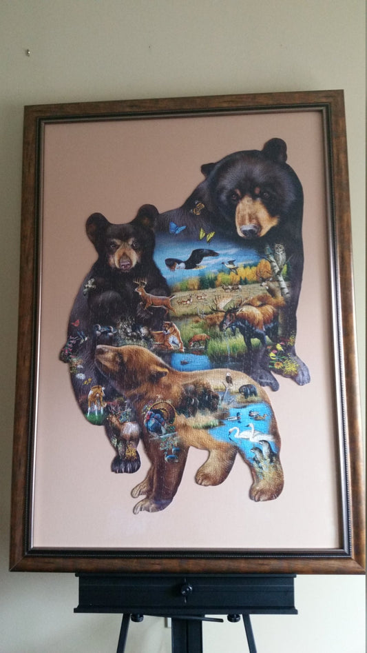 Professionally Framed 1000pc completed Sunsout Bear Family Adventure shaped puzzle wall art. Eco Friendly item with gloss finish.