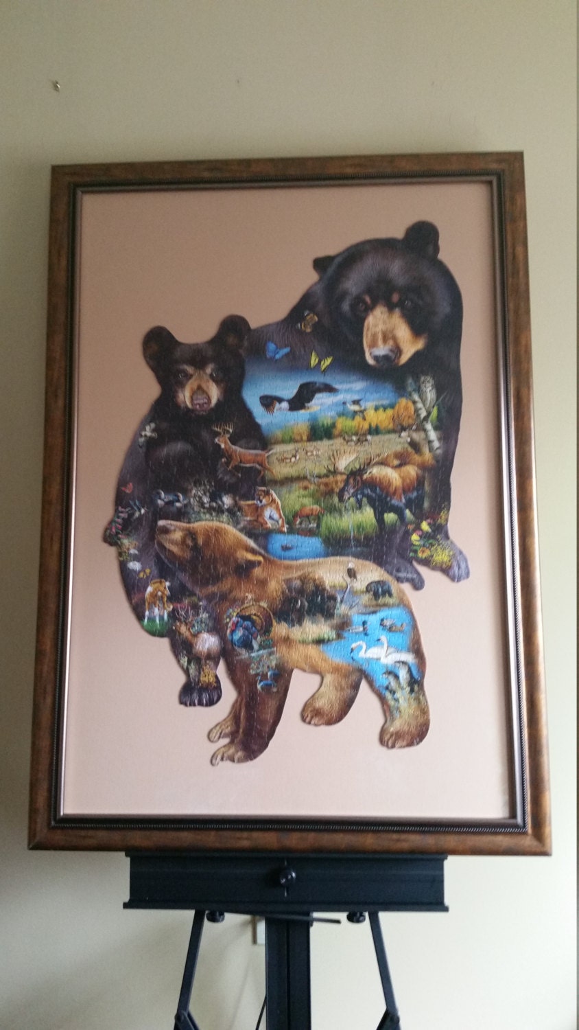 Professionally Framed 1000pc completed Sunsout Bear Family Adventure shaped puzzle wall art. Eco Friendly item with gloss finish.