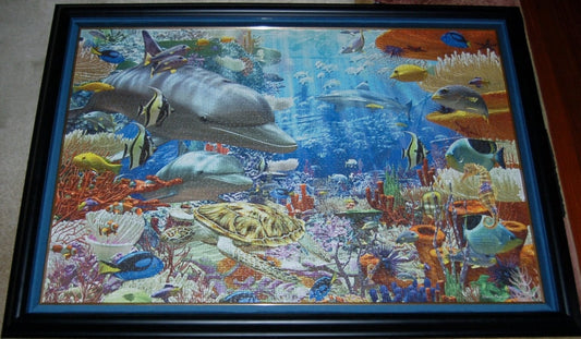 Professionally framed wall art, home decor, and office decor. 3000 piece completed Ocean Ravensburger puzzle framed by Pictures Plus.